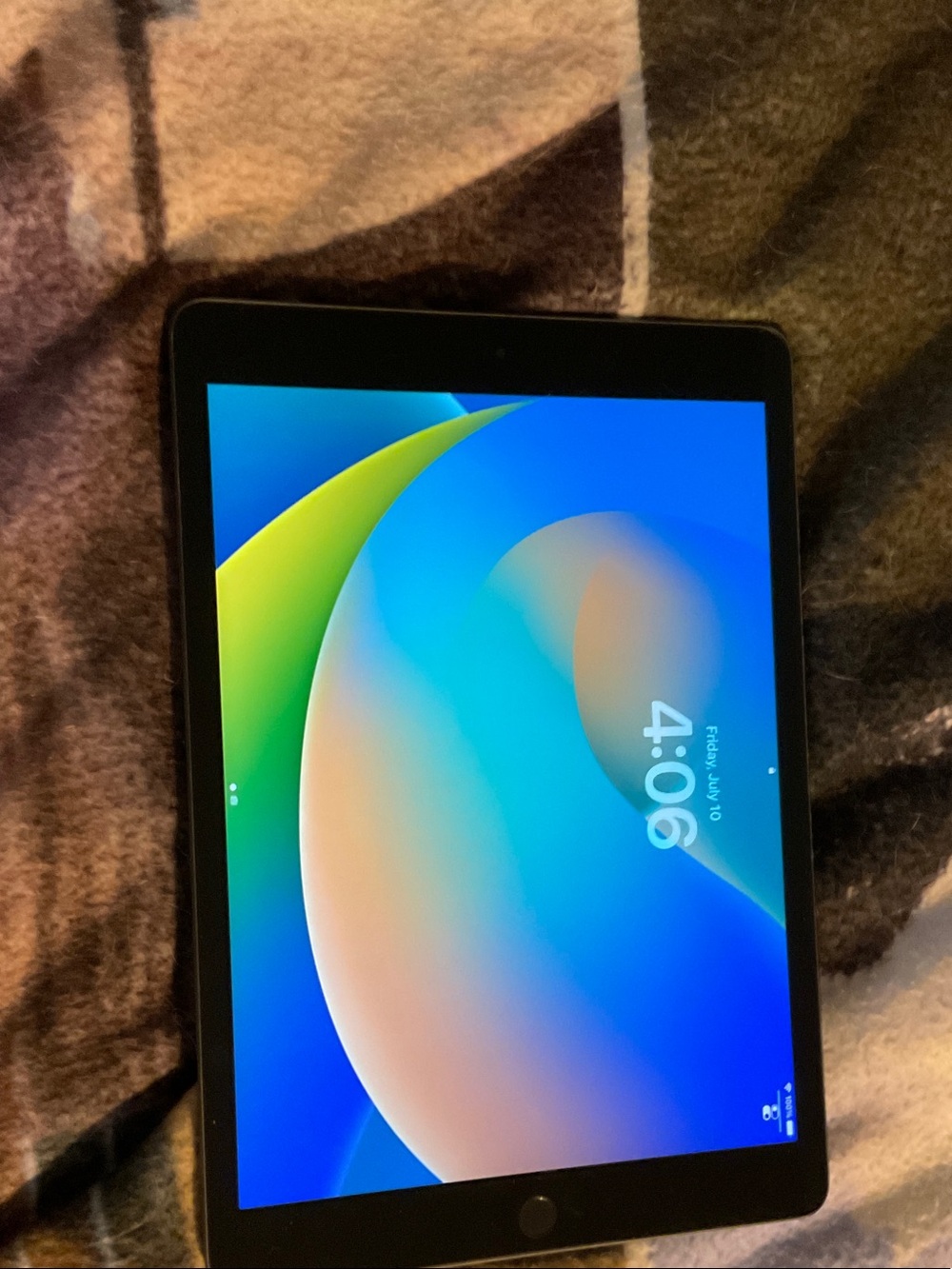 Apple Tablet in Black with Blue and Green Display Accents